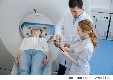 Nice professional doctors using a tablet Nice professional doctors using a tablet 29861140