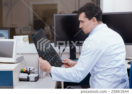 Nice good looking man thinking about his patient 29861644