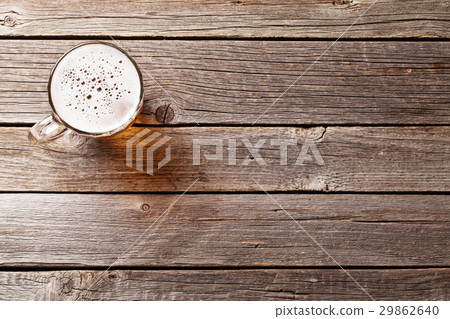 Beer mug on wooden table 29862640
