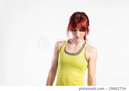 Attractive young fitness woman in green tank top Attractive young fitness woman in green tank top 29862734