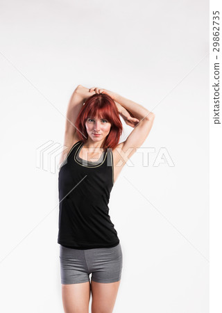 Attractive young fitness woman in green tank top Attractive young fitness woman in green tank top 29862735