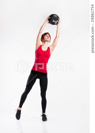 Fitness woman in red tank top holding medicine 29862754