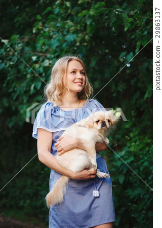 young beautiful girl with pekingese young beautiful girl with pekingese 29863137