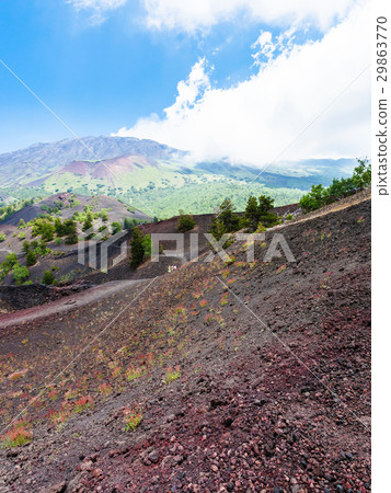 tourists walk on path between old crater 29863770