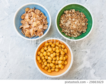 three kind of cold breakfast cereals on table three kind of cold breakfast cereals on table 29863829