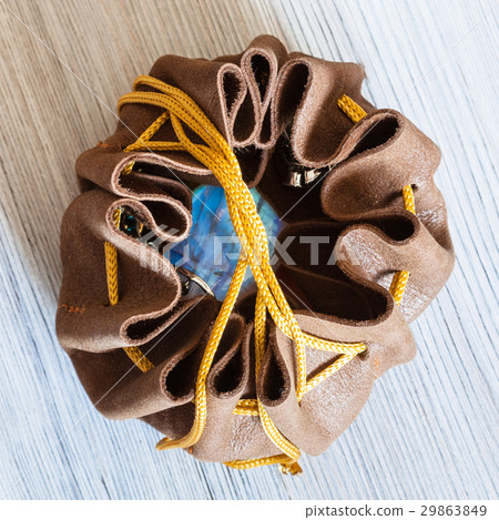 top view of open leather purse with moonstone gem top view of open leather purse with moonstone gem 29863849