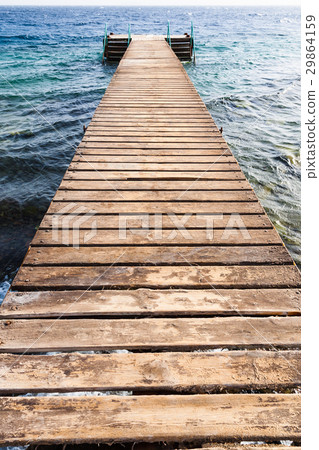 wooden pier on Coral beach of Red Sea in Aqaba wooden pier on Coral beach of Red Sea in Aqaba 29864159