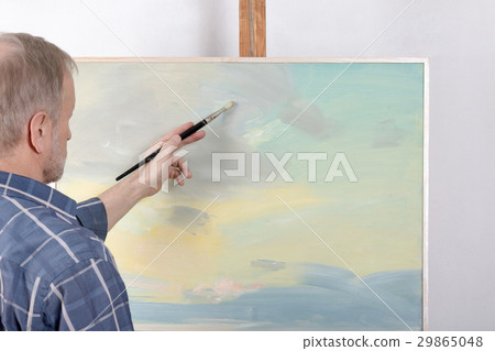 An artist painting in studio An artist painting in studio 29865048