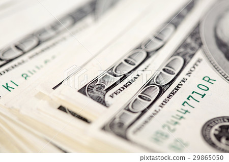 A pile of one hundred US dollar bills A pile of one hundred US dollar bills 29865050