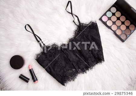 Black lace top on white fur. Lipstick, eyeshadow Black lace top on white fur. Lipstick, eyeshadow 29875346