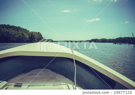 Traveling in the river with small boat, summer day Traveling in the river with small boat, summer day 29877128
