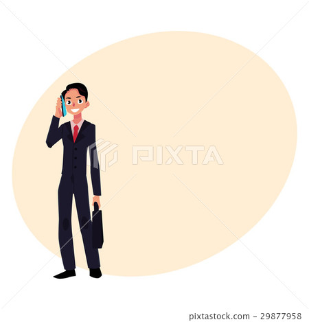 Young businessman standing, talking by mobile 29877958