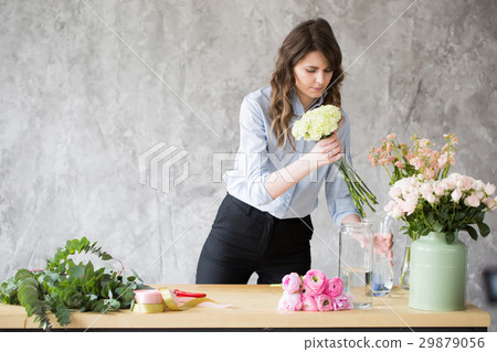 Florist at work: pretty young woman making fashion 29879056