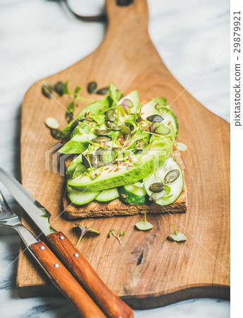 Healthy green veggie sandwich with avocado on 29879921