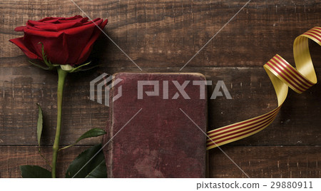 red rose, catalan flag and old book 29880911