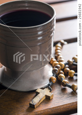 Rosary beads and cup of wine. 29881942