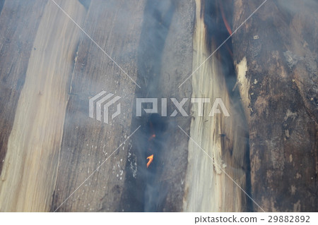 Smoked wood burning in a BBQ 20224 Smoked wood burning in a BBQ 20224 29882892