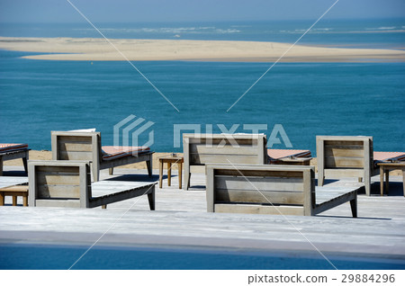 Beautiful tropical beach with chairs and 29884296