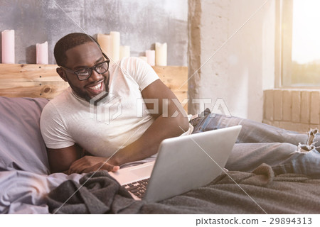 Smart young African American man freelancing at Smart young African American man freelancing at 29894313