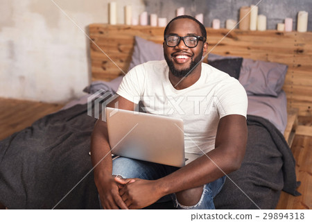 Charming young African American working at home 29894318