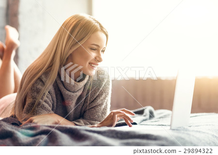 Happy young woman enjoying free time at home 29894322