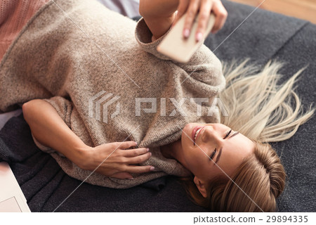 Fashionable young girl taking selfie in the Fashionable young girl taking selfie in the 29894335