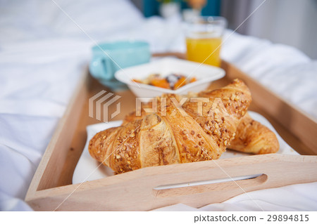 breakfast in bed with coffee and croissants 29894815