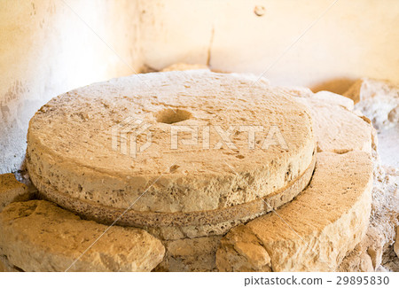 Old stone mill with heavy millstones smooth 29895830