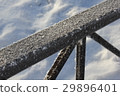 Snow-covered metal fence 30411 29896401