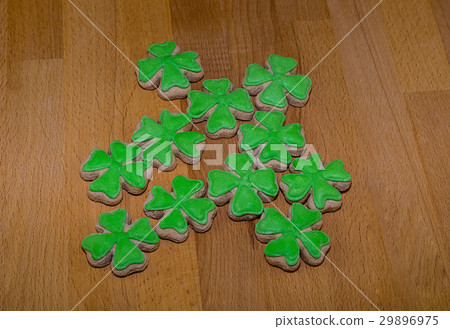 Delicious cookies bright clover on a wooden table Delicious cookies bright clover on a wooden table 29896975