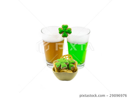 Two glasses of a foamy drink amber and green beer Two glasses of a foamy drink amber and green beer 29896976