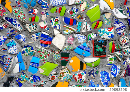 Wall with broken ceramic plates colored fragments  29898298