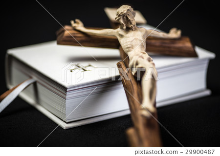 White prayer book and brown cross White prayer book and brown cross 29900487