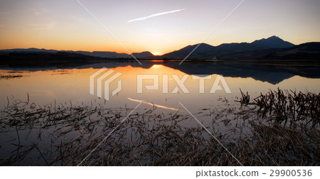 Colorful sunset over lake and mountains 29900536