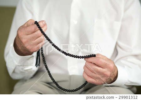 Praying hands of an old muslim man Praying hands of an old muslim man 29901312