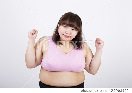 Smiling young lady with a smile of a camera looking up in her hands in front of a white background Smiling young lady with a smile of a camera looking up in her hands in front of a white background 29908905