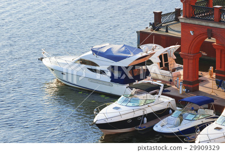 White motorboats tied at the dock 29909329