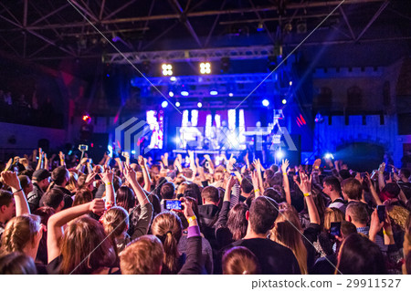 The silhouettes of concert crowd in front of 29911527