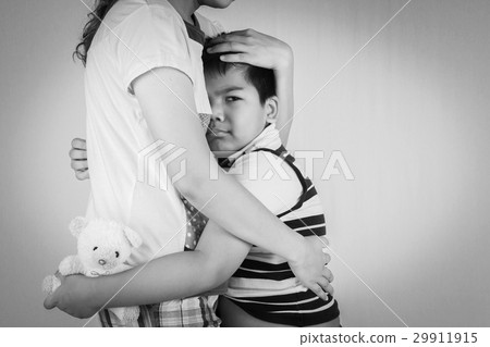 Little boy sad in hugging of mother Little boy sad in hugging of mother 29911915