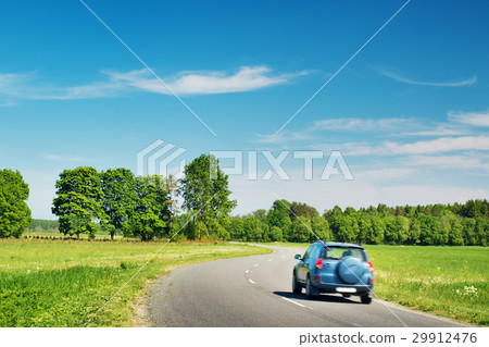 Car on asphalt road in beautiful spring day 29912476