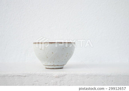 white ceramic tea cup with cement wall background white ceramic tea cup with cement wall background 29912657