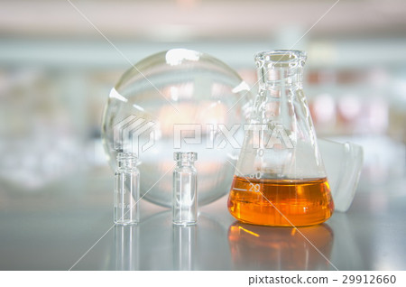orange flask and round bottle in science lab 29912660