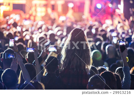 The silhouettes of concert crowd in front of The silhouettes of concert crowd in front of 29913216