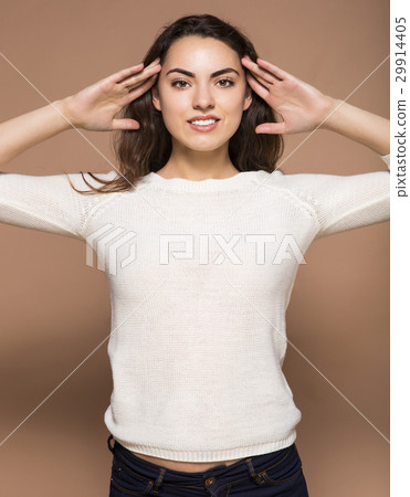 Beautiful woman with curly hair isolated on beige 29914405