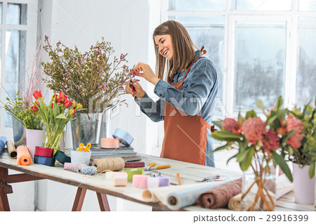 Florist at work: the young girl making fashion Florist at work: the young girl making fashion 29916399