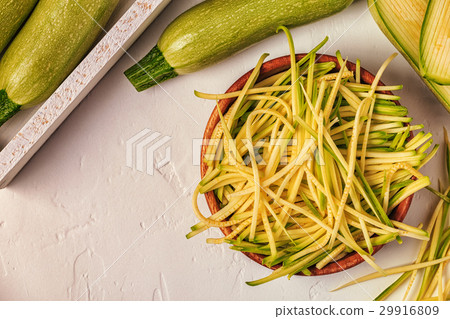 Raw zucchini pasta on white background. 29916809