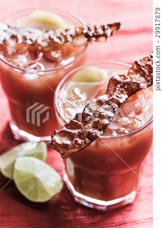 Two glasses of Bloody Mary with bacon rashers Two glasses of Bloody Mary with bacon rashers 29917879