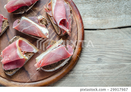 Sandwiches with  italian ham on the wooden board 29917987