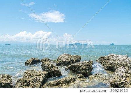 Beach and sea with blue sky and reef rock beach Beach and sea with blue sky and reef rock beach 29921613
