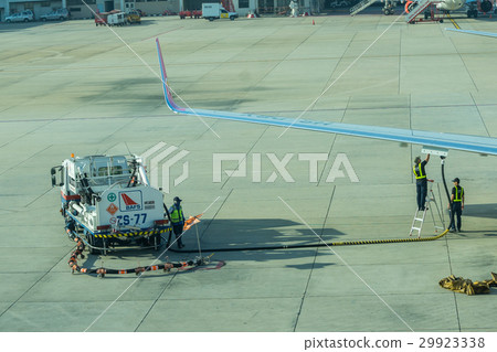 airport officer and truck Refueling to aircraft airport officer and truck Refueling to aircraft 29923338
